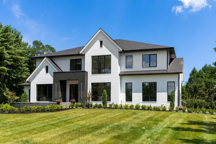 Front exterior of GSS Builders’ modern white brick luxury home at 10809 South Glen Road in Potomac, Maryland