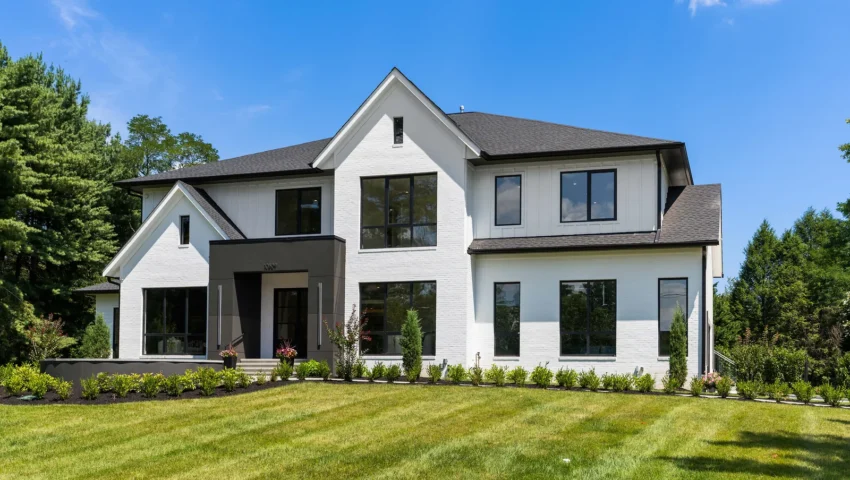 Front exterior of GSS Builders’ modern white brick luxury home at 10809 South Glen Road in Potomac, Maryland