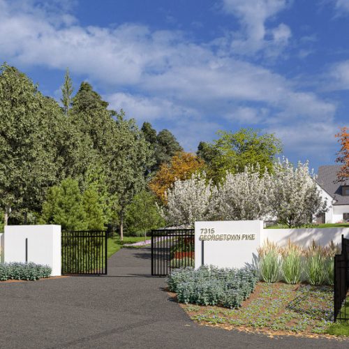 Landscaped gated entry of McLean VA property showcasing privacy, greenery, and modern estate appeal.