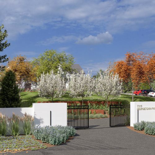 Private gated entrance of luxury home in McLean VA with landscaped driveway and secure access.